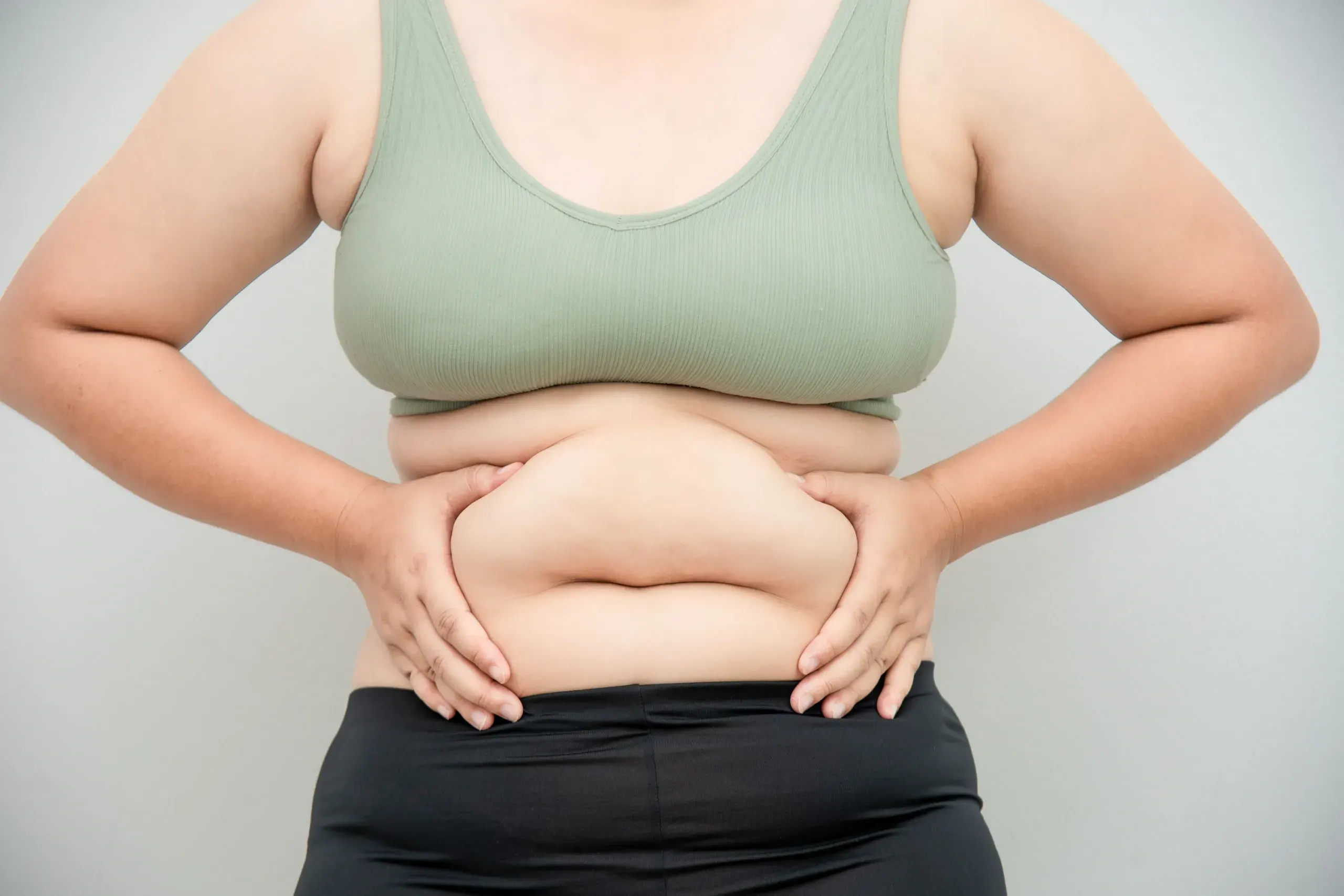 Patient evaluating stubborn fat concerns at Hartley Health and Wellness Canton GA
